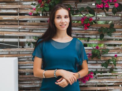 young-stylish-beautiful-woman-blue-dress-summer-fashion-trend-vacation-garden-tropical-hotel-terrace-smiling_285396-3866